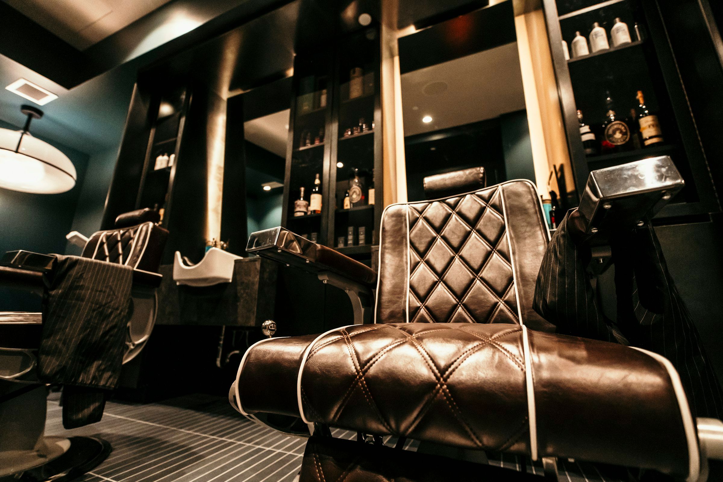 Barber chair facing a mirror inside a barbershop, similar to the walk-in setup at Classic Chair Barbershop in Newmarket